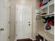 Practical mudroom with built-in storage, bench, and door to the garage at 26881 E Roxbury Pl, Aurora, CO 80016