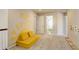 Spacious play area features soft carpeting, modular seating, and natural lighting at 26881 E Roxbury Pl, Aurora, CO 80016