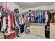 Walk-in closet features ample storage space and organized shelving at 26881 E Roxbury Pl, Aurora, CO 80016
