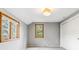 Bedroom featuring two windows and a closet at 7873 E Colgate Pl, Denver, CO 80231