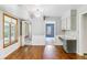 Spacious dining area with hardwood floors and modern lighting, perfect for entertaining at 7873 E Colgate Pl, Denver, CO 80231