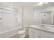 Bathroom featuring neutral tile floor, vanity, and a shower and tub combo at 837 Ledge St, Lochbuie, CO 80603