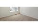 Bedroom featuring neutral carpet, and large window providing ample natural light at 837 Ledge St, Lochbuie, CO 80603