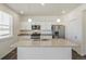 A kitchen island with granite countertops, stainless steel appliances, and pendant lighting at 837 Ledge St, Lochbuie, CO 80603