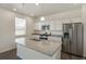 Kitchen featuring stainless steel appliances, granite countertops, and an island at 837 Ledge St, Lochbuie, CO 80603