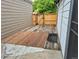 Backyard patio with wooden boards and access to the side of the home at 11196 E Baltic Dr, Aurora, CO 80014
