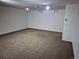 Spacious carpeted basement with recessed lighting and painted white walls at 11196 E Baltic Dr, Aurora, CO 80014