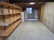 Unfinished basement with exposed wood and shelving offers customization possibilities at 11196 E Baltic Dr, Aurora, CO 80014