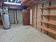 Unfinished basement with exposed wood offers customization possibilities at 11196 E Baltic Dr, Aurora, CO 80014