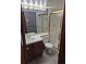 Functional bathroom with vanity, toilet, and shower stall offers essential amenities at 11196 E Baltic Dr, Aurora, CO 80014