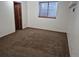 Carpeted bedroom with natural light offers a cozy and inviting atmosphere at 11196 E Baltic Dr, Aurora, CO 80014