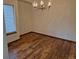 Bright dining room with wood floors and elegant lighting fixture, perfect for entertaining at 11196 E Baltic Dr, Aurora, CO 80014