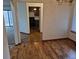 Dining room showcasing wood floors, with a view of the adjacent kitchen at 11196 E Baltic Dr, Aurora, CO 80014