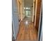 Inviting entryway with wood floors, leading to an open living space with natural light at 11196 E Baltic Dr, Aurora, CO 80014