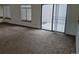 Bright living room with sliding glass doors that offer a seamless transition to the outdoors and a view of the backyard at 11196 E Baltic Dr, Aurora, CO 80014