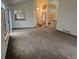 Open living room with lots of natural light, showing transition into dining room and multiple living spaces at 11196 E Baltic Dr, Aurora, CO 80014