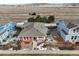 Aerial view of red house with backyard and surrounding homes at 16845 Buffalo Valley Path, Monument, CO 80132