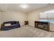 Spacious finished basement room with a fireplace and a couch at 16845 Buffalo Valley Path, Monument, CO 80132