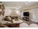 Finished basement Gathering room with sectional sofa and large TV at 16845 Buffalo Valley Path, Monument, CO 80132