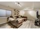 Finished basement rec room with sectional sofa and decorative wall art at 16845 Buffalo Valley Path, Monument, CO 80132