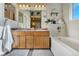 Elegant bathroom with double sinks, a large soaking tub, and a separate shower at 16845 Buffalo Valley Path, Monument, CO 80132