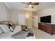 Primary bedroom with TV, dresser and en-suite bathroom at 16845 Buffalo Valley Path, Monument, CO 80132