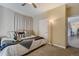 Spacious bedroom with ceiling fan and en-suite bathroom at 16845 Buffalo Valley Path, Monument, CO 80132