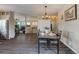 Open concept dining area with hardwood floors and kitchen view at 16845 Buffalo Valley Path, Monument, CO 80132