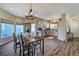 Kitchen and dining area with hardwood floors and an open floor plan at 16845 Buffalo Valley Path, Monument, CO 80132