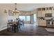 Bright dining area with hardwood floors and a chandelier at 16845 Buffalo Valley Path, Monument, CO 80132