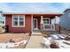 Red siding ranch home with a covered porch and stone accents at 16845 Buffalo Valley Path, Monument, CO 80132