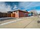 Red house exterior with garage and driveway at 16845 Buffalo Valley Path, Monument, CO 80132
