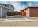 Side yard with wooden fence and small patio at 16845 Buffalo Valley Path, Monument, CO 80132