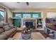 Living room with a fireplace and built-in shelving at 16845 Buffalo Valley Path, Monument, CO 80132