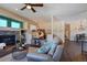 Open concept living room with fireplace and hardwood floors at 16845 Buffalo Valley Path, Monument, CO 80132