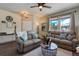 Spacious living room with fireplace, hardwood floors, and comfortable seating at 16845 Buffalo Valley Path, Monument, CO 80132