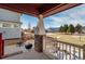 Covered porch with mountain views and a grill at 16845 Buffalo Valley Path, Monument, CO 80132
