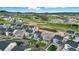 Bird's eye view of the backyard with a well-manicured lawn and a beautiful neighborhood at 624 Simmental Loop, Castle Rock, CO 80104