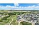 Beautiful aerial view of the community with a walking trail surrounded by greenery and mountains in the background at 624 Simmental Loop, Castle Rock, CO 80104