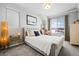 Bedroom featuring a large window, and a queen bed with neutral walls and carpet at 624 Simmental Loop, Castle Rock, CO 80104
