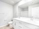 Bright bathroom featuring a double sink vanity with modern fixtures and a large mirror at 22495 E 7Th Pl, Aurora, CO 80018