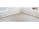 Bright bedroom with neutral carpet, white trim, and natural light from the windows at 22495 E 7Th Pl, Aurora, CO 80018