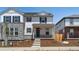 Charming two-story home with stone accents, black shutters, and inviting front porch at 22495 E 7Th Pl, Aurora, CO 80018