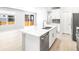 Bright kitchen with white cabinets, quartz countertops, and stainless steel appliances at 22495 E 7Th Pl, Aurora, CO 80018