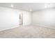 Large living room with neutral carpet and a doorway view into a bathroom with shower at 22495 E 7Th Pl, Aurora, CO 80018