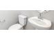 Contemporary powder room features a modern sink and toilet with neutral wall paint at 22495 E 7Th Pl, Aurora, CO 80018