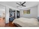 Bright bedroom with hardwood floors, ceiling fan, closet, and artwork at 5132 Eaton St, Denver, CO 80212