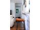 Modern breakfast bar with wood stools, granite countertop, and view into a relaxing living space at 5132 Eaton St, Denver, CO 80212