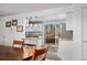 Dining area open to a modern kitchen and a sliding glass door to the outdoor deck at 5132 Eaton St, Denver, CO 80212