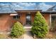 Charming brick home featuring well-maintained landscaping and a secure front entry at 5132 Eaton St, Denver, CO 80212